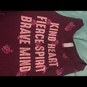 A tank top with floral print and righting